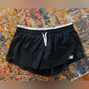 New balance running shorts with built in lining. Size is M but fits small/short